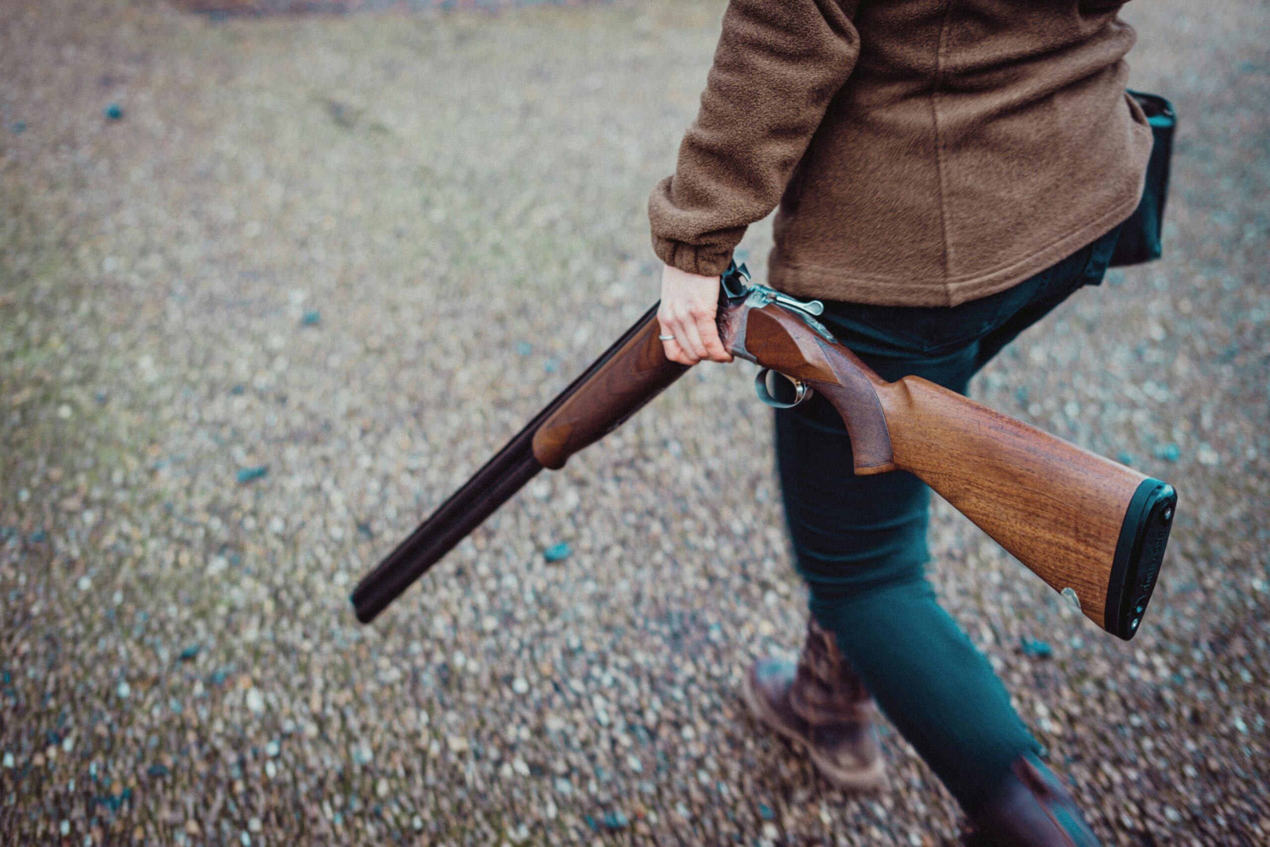 Shooting Pest Control in Wiltshire - Licensed pest controller walking with shotgun in rural Wiltshire

